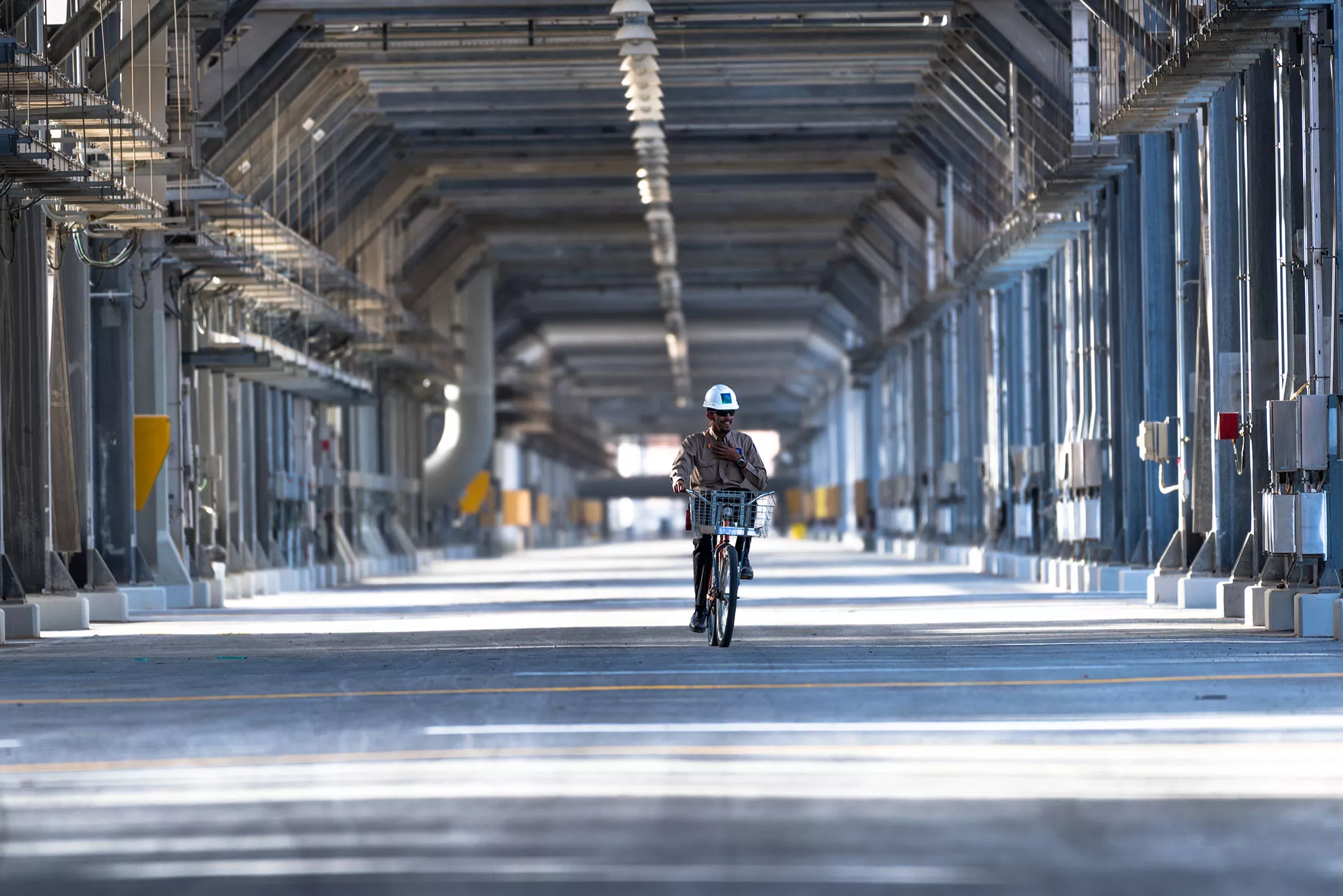 Worker cycling through the Shaybah Gas Plant