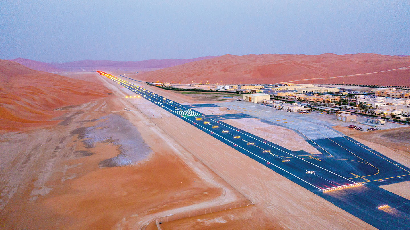 Lying deep within the heart of the remote Rub’ al-Khali, Shaybah’s airport runway is exposed to blistering conditions and pounded by the corrosive sands, but its concrete was successfully recycled and reused as a base layer for its upgrade. 